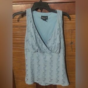 Cute lacey light blue top. Looks cute with camisole under. Casual or dressy.